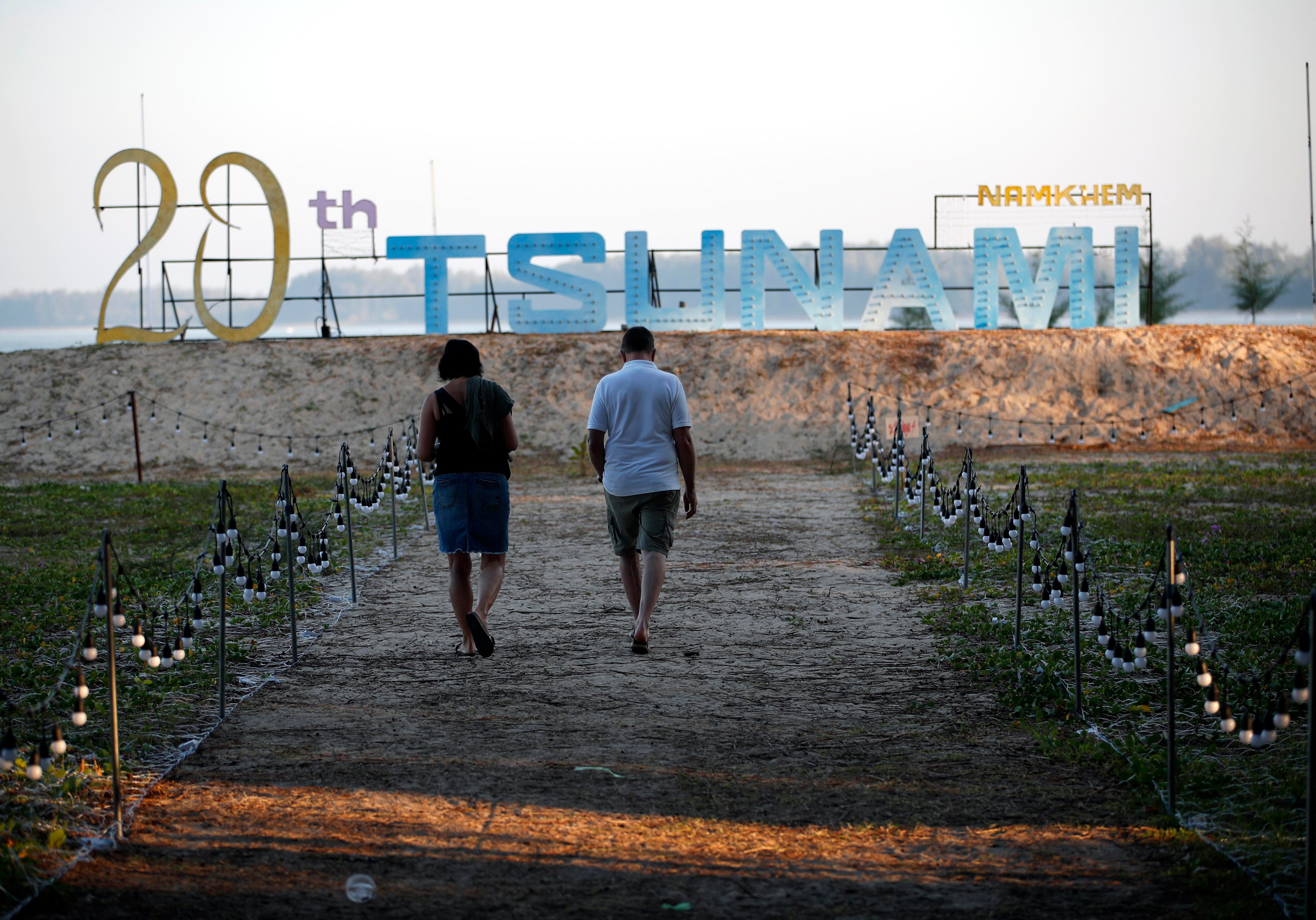 Takua Pa (Thailand), 26/12/2024.- German tsunami survivor from Aschaffenburg Claus Gerhart (R) and his wife visit a memorial park to commemorate the 20th anniversary of the 2004 tsunami at Tsunami Memorial Park in Ban Nam Khem, Phang Nga province, southern Thailand, 26 December 2024. Gerhart, 59, survived the 2004 tsunami, but he lost his youngest daughter and one friend in Thailand. Thailand commemorates the 20th anniversary of the 2004 Indian Ocean tsunami, which struck on 26 December 2004, triggered by a 9.2 magnitude earthquake in the Indian Ocean off the west coast of northern Sumatra, Indonesia. The tsunami claimed over 220,000 lives, internally displaced more than half a million people, and left hundreds of thousands without livelihoods, according to the United Nations, making it one of the deadliest natural disasters in history. Indonesia, Sri Lanka, India, the Maldives, and Thailand sustained massive damage from the catastrophe. (Terremoto/sismo, Maldivas, Tailandia) EFE/EPA/RUNGROJ YONGRIT