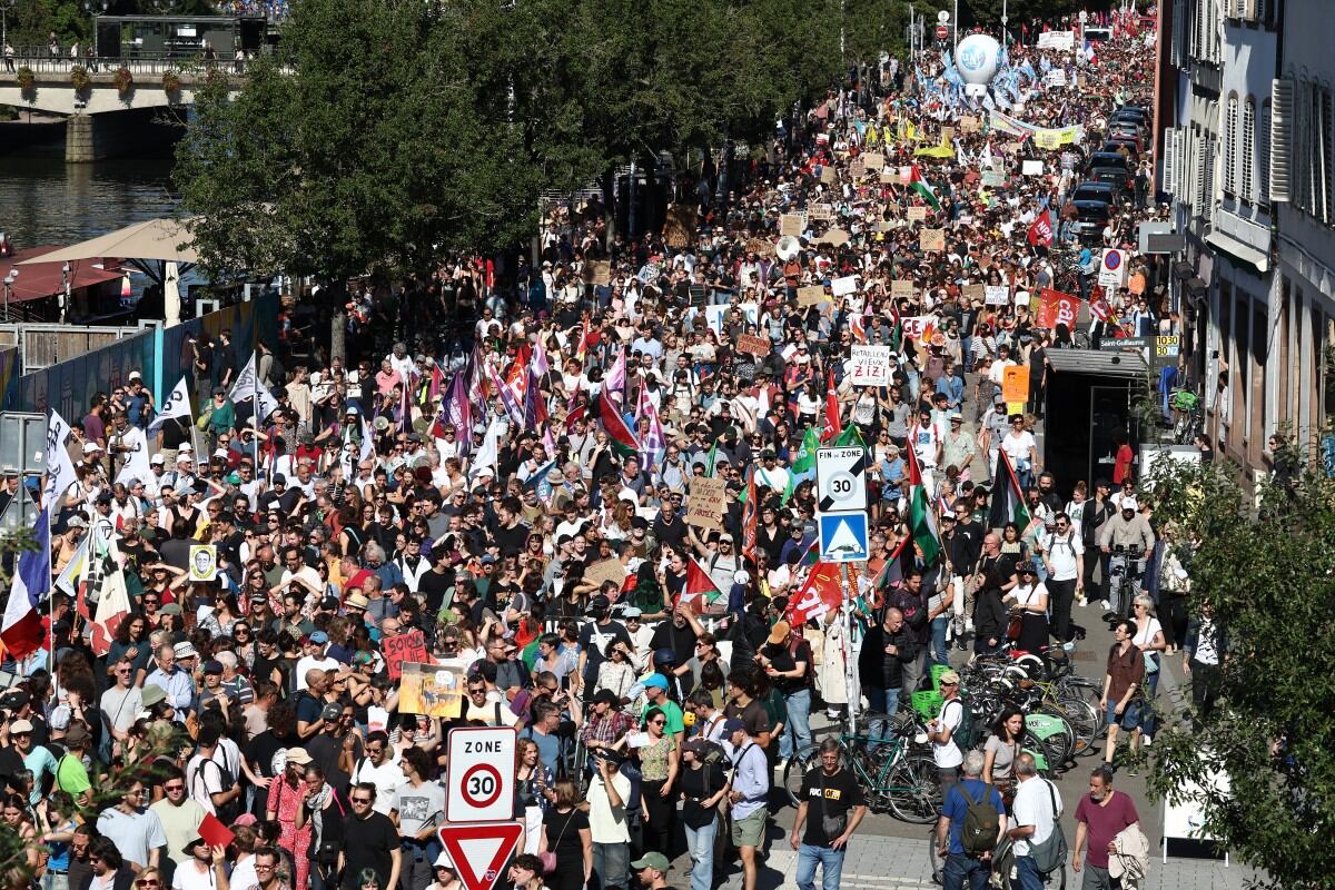 Protestors demonstrate in Strasbourg, eastern France on September 18, 2025, during a day of nationwide strikes and protests called by unions over France's national budget. France is bracing for a day of nationwide protests on September 18, 2025, with a source close to the authorities saying some 800,000 people are expected to take to the streets. In a rare show of unity, trade unions have urged French people to strike in protest at the authorities' "horror show" draft budget designed to reduce France's ballooning debt. (Photo by FREDERICK FLORIN / AFP)
