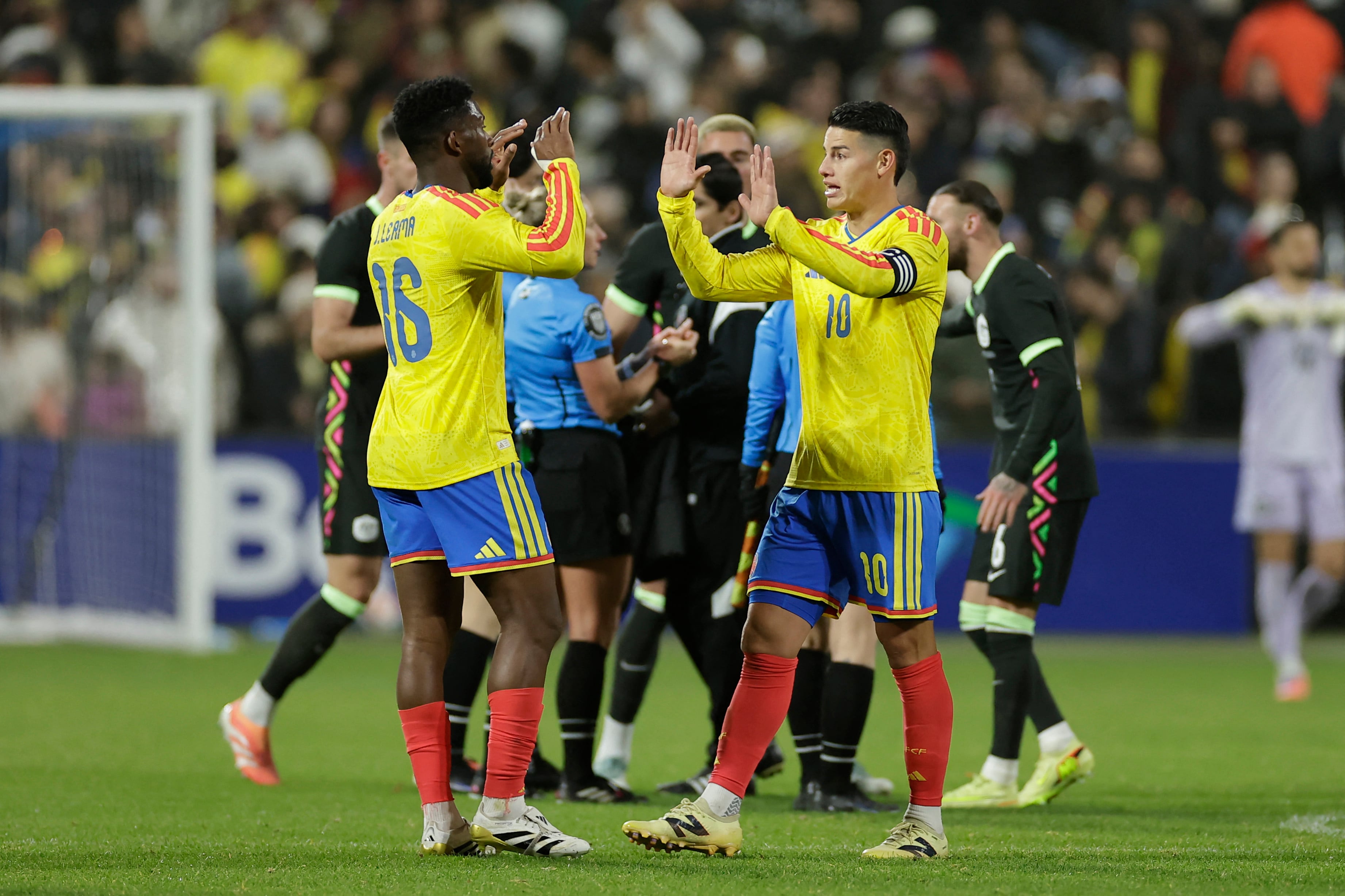 NEW YORK, NEW YORK - NOVEMBER 18: Jefferson Lerma and James Rodriguez of Colombia react after winning the International Friendly match between Colombia and Australia at Citi Field on November 18, 2025 in New York City. Adam Hunger/Getty Images for Soccer Australia/AFP (Photo by Adam Hunger / GETTY IMAGES NORTH AMERICA / Getty Images via AFP)