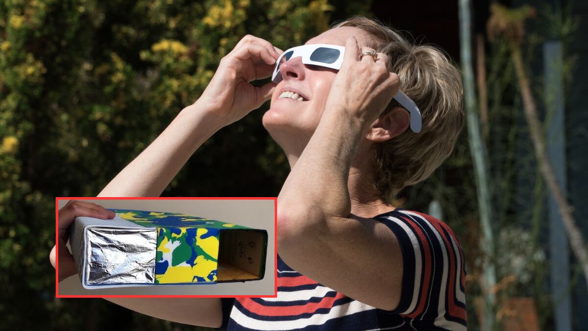 Mujer viendo el Eclipse Solar con gafas / Visor solar casero (Getty Images)
