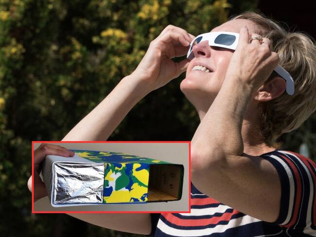 Mujer viendo el Eclipse Solar con gafas / Visor solar casero (Getty Images)