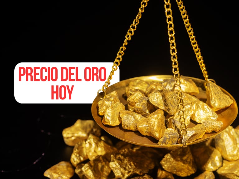 Pedazos de oro sobre una balanza / Precio del oro hoy (Getty Images)