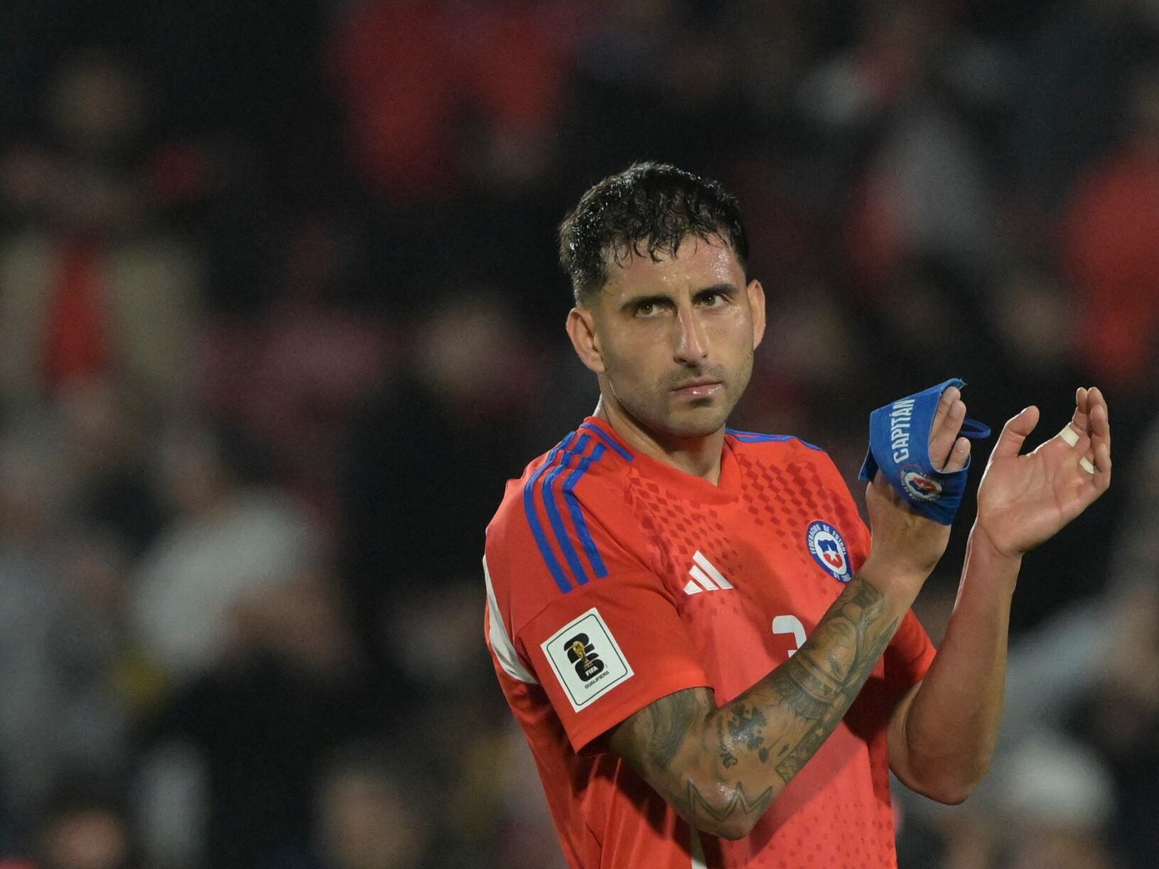 Chile's defender Guillermo Maripan reacts after losing the 2026 FIFA World Cup South American qualifiers football match between Chile and Brazil, at the National stadium in Santiago, on October 10, 2024. (Photo by Rodrigo ARANGUA / AFP) (Photo by RODRIGO ARANGUA/AFP via Getty Images)