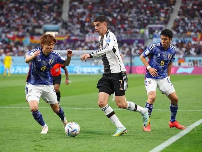 DOHA, QATAR - NOVEMBER 23: Kai Havertz of Germany battles for possession with Kou Itakura (L) and Wataru Endo of Japan during the FIFA World Cup Qatar 2022 Group E match between Germany and Japan at Khalifa International Stadium on November 23, 2022 in Doha, Qatar. (Photo by Alex Grimm/Getty Images)