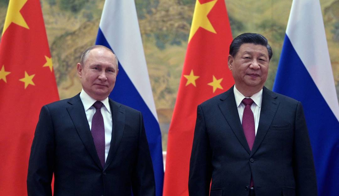 Russian President Vladimir Putin (L) and Chinese President Xi Jinping pose during their meeting in Beijing, on February 4, 2022 -GettyImages