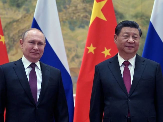 Russian President Vladimir Putin (L) and Chinese President Xi Jinping pose during their meeting in Beijing, on February 4, 2022 -GettyImages