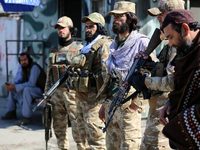 Taliban security personnel stand guard along a road after gunfire erupted between Afghanistan and Pakistan border forces near the Torkham border crossing between Afghanistan and Pakistan, in Nangarhar province on February 20, 2023. - Gunfire erupted between Afghanistan and Pakistan border forces on February 20 after Taliban authorities shut the country's busiest crossing with its eastern neighbour, officials said. (Photo by Shafiullah KAKAR / AFP) (Photo by SHAFIULLAH KAKAR/AFP via Getty Images)