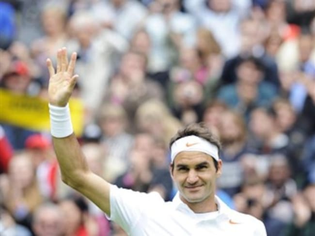 Roger Federer inició la defensa del título con fácil victoria sobre Victor Hanescu