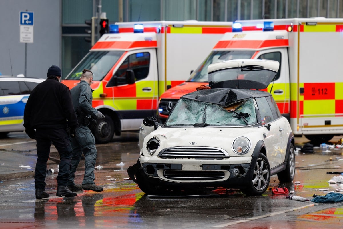Members of the emergengy services work at the scene where a car drove into a crowd in the southern German city of Munich on February 13, 2025 leaving several people injured, police said. Munich police said on social media platform X that "several people were injured" after "a car drove into a group of people" in the centre of the Bavarian state capital. (Photo by Michaela STACHE / AFP)