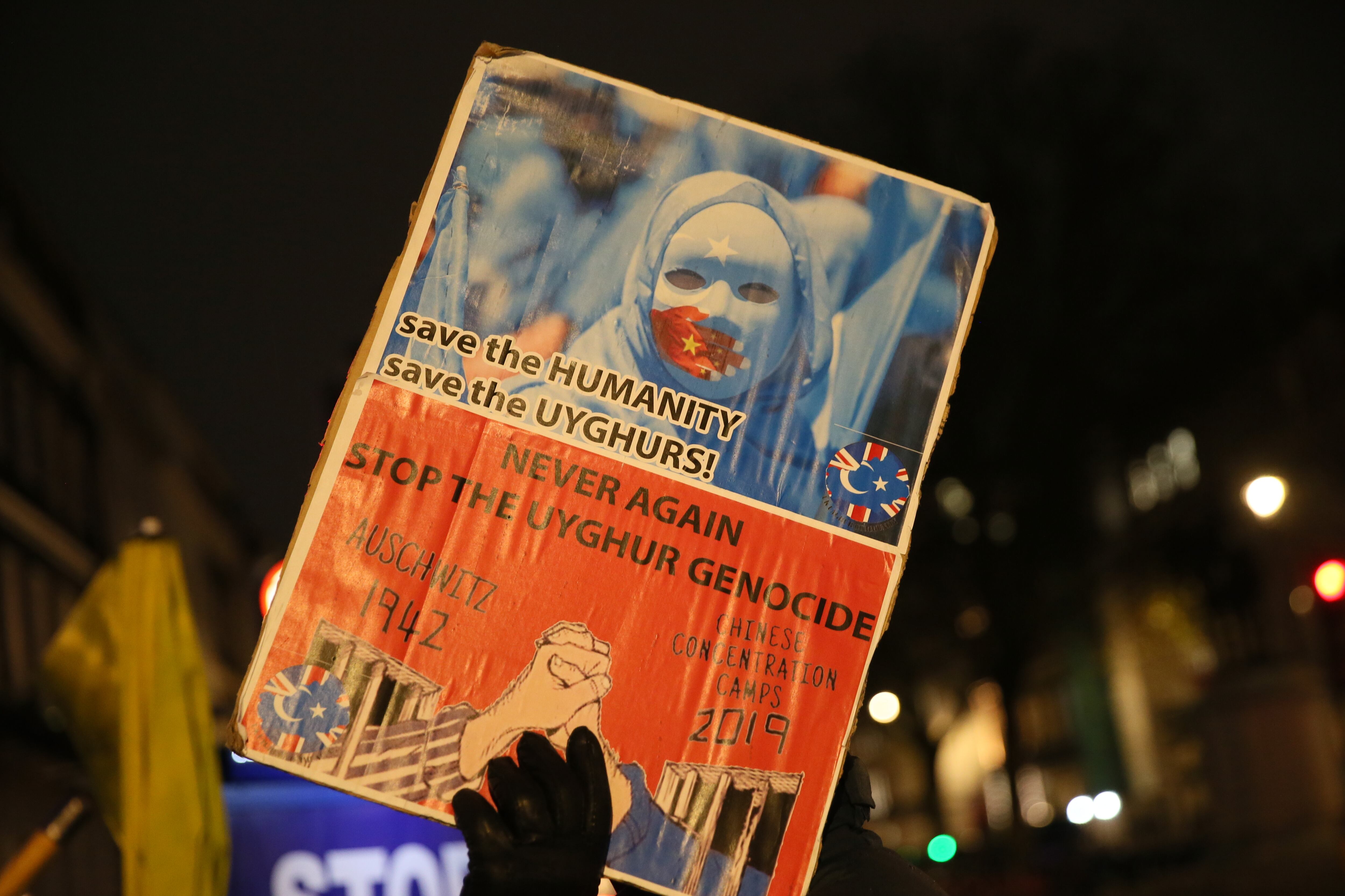 LONDON, UNITED KINGDOM - DECEMBER 9: People stage a protest in front of the Chinese Embassy after the Uyghur Tribunal ruled that China committed genocide against Uyghurs and other ethnic minorities through policies such as coerced birth control and sterilization in London, United Kingdom on December 9, 2021. (Photo by Hasan Esen/Anadolu Agency via Getty Images)
