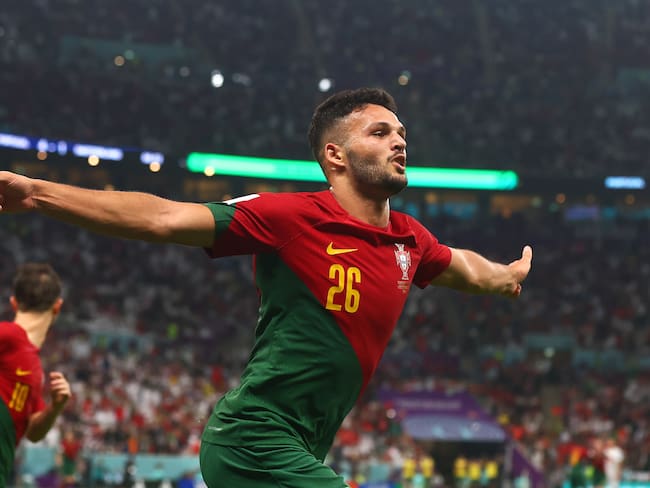 LUSAIL CITY, QATAR - DECEMBER 06:   Goncalo Ramos of Portugal celebrates scoring his sides fifth goal during the FIFA World Cup Qatar 2022 Round of 16 match between Portugal and Switzerland at Lusail Stadium on December 6, 2022 in Lusail City, Qatar. (Photo by Chris Brunskill/Fantasista/Getty Images)