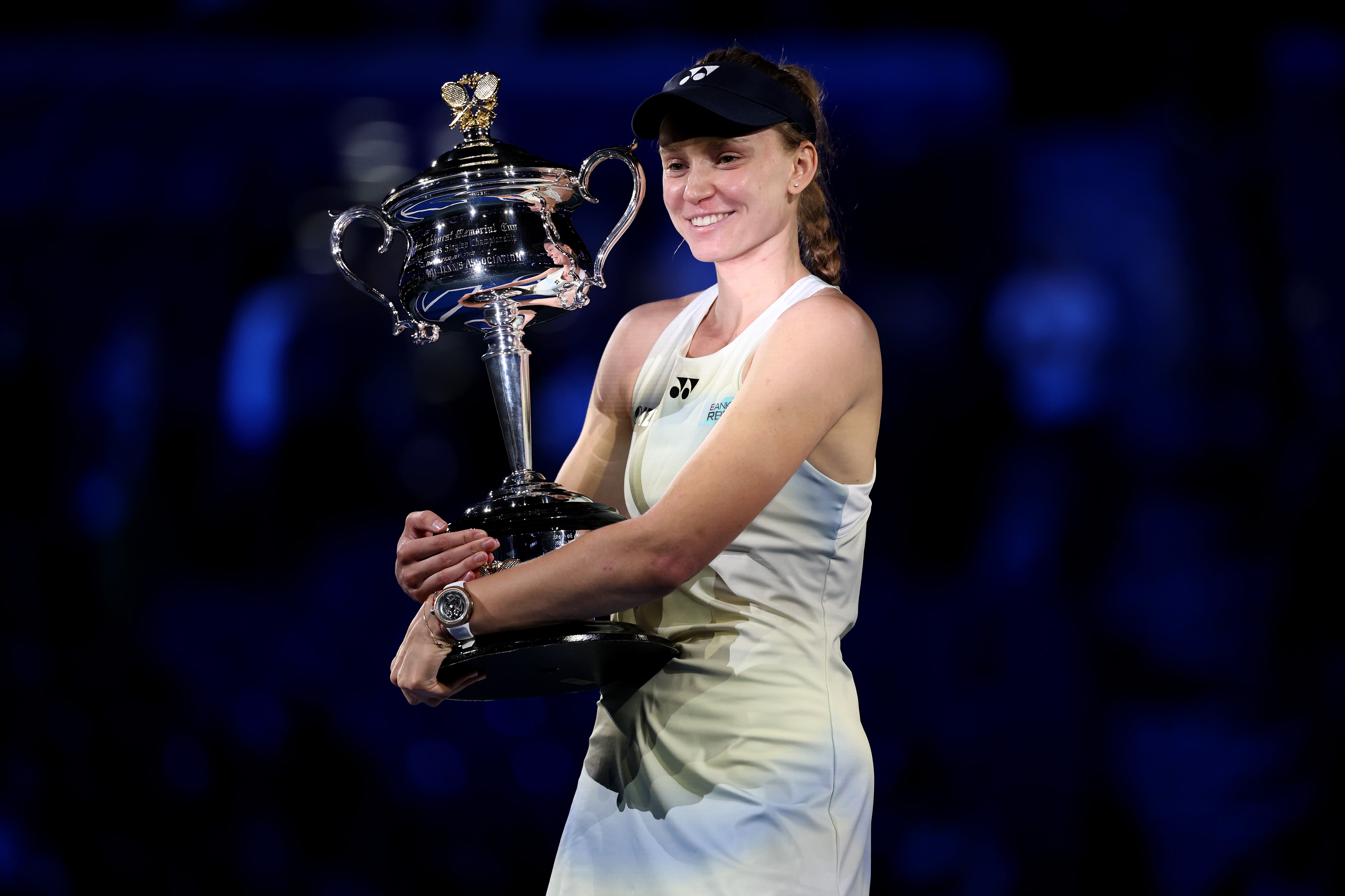 MELBOURNE, AUSTRALIA - FEBRUARY 01: Elena Rybakina of Kazakhstan poses with the Daphne Akhurst Memorial Cup after her victory in the Women's Singles Final against Aryna Sabalenka during day 15 of the 2026 Australian Open at Melbourne Park on February 01, 2026 in Melbourne, Australia. (Photo by Phil Walter/Getty Images)