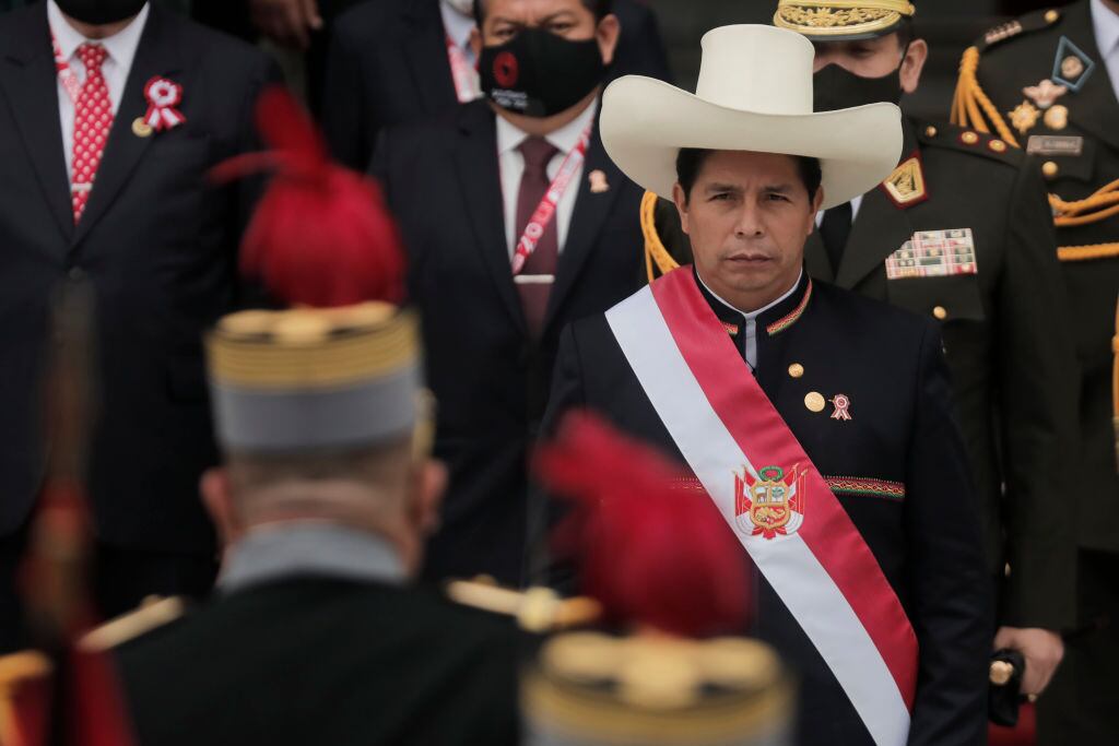 LIMA, PERU - JULY 28: President of Peru Pedro Castillo walks out of Congress wearing the presidential sash after the presidential inauguration on July 28, 2021 in Lima, Peru. Castillo of Peru Libre defeated Keiko Fujimori of Fuerza Popular by a slight difference in the runoff on June 6. Peruvians are also celebrating the 200th anniversary of their independence. (Photo by Getty Images/Getty Images)