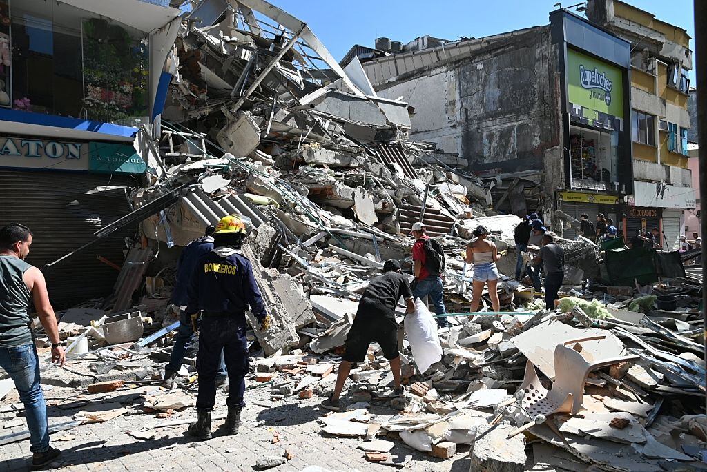 PEREIRA, COLOMBIA - AUGUST 10: Residents and rescue workers carry out search, rescue and evacuation operations after a powerful earthquake struck Colombia, killing at least 18 people and causing widespread damage in Pereira, on August 10, 2026 in Pereira, Colombia. Preliminary reports indicate that several structures collapsed, buildings and roads were damaged, and some public services were temporarily disrupted. Hospitals activated emergency plans to treat the injured, while technical teams began assessing damaged buildings as authorities warned residents to avoid unsafe structures and remain alert for aftershocks. (Photo by Alexis Munera/Anadolu via Getty Images)