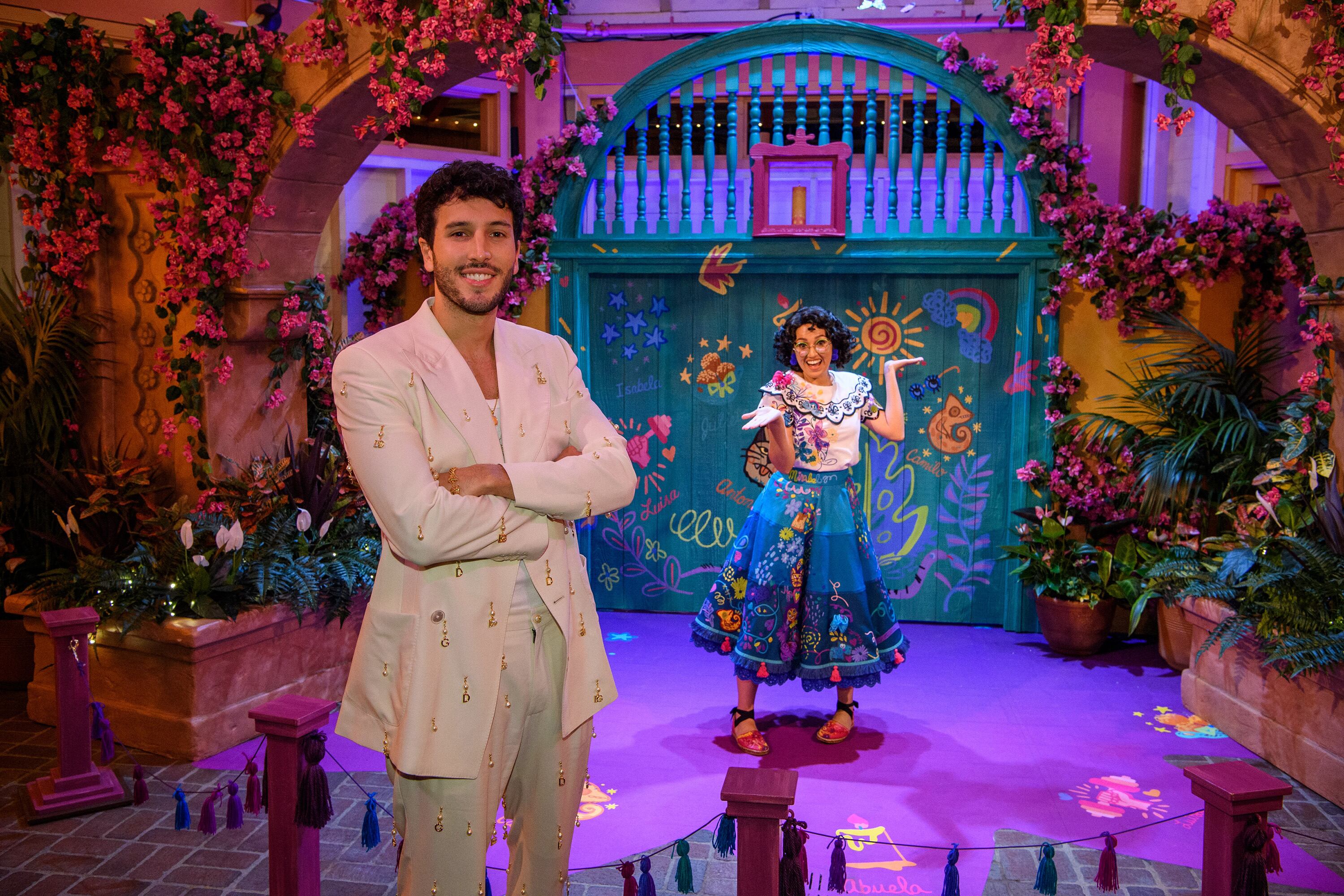 THE WONDERFUL WORLD OF DISNEY: MAGICAL HOLIDAY CELEBRATION - Singer and songwriter Sebastián Yatra meets Mirabel of the new Walt Disney Animation Studios film, Encanto, at Disney California Adventure Park while on break from performing in The Wonderful World of Disney: Magical Holiday Celebration, airing Sunday, Nov. 28, 7-9 p.m. ET/PT. (Richard Harbaugh/Disney via Getty Images)SEBASTIÁN YATRA, MIRABEL