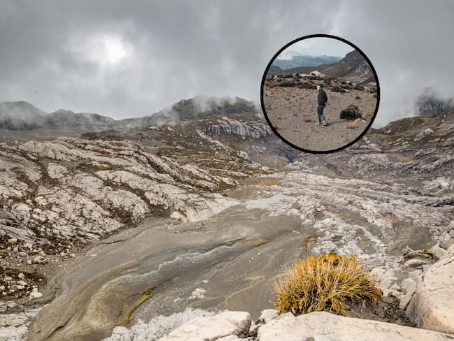 Paisaje rocoso en el Volcán Nevado del Ruiz y e fondo una persona explorando este ecosistema (Fotos vía Getty Images)