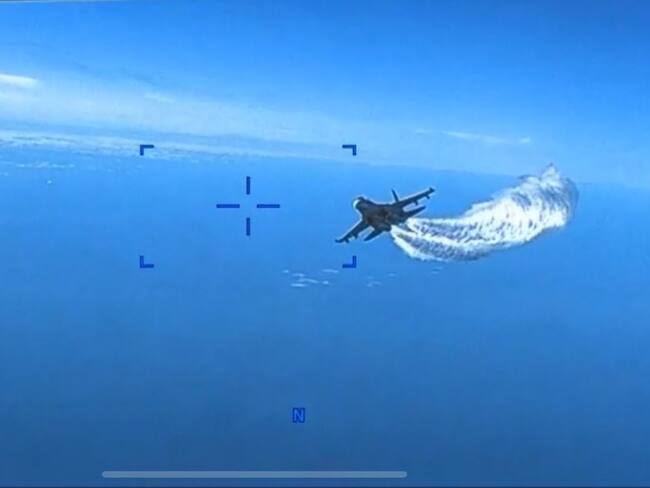 Camera footage release from U.S. Air Force MQ-9 interaction with Russian SU-27 in Black Sea.