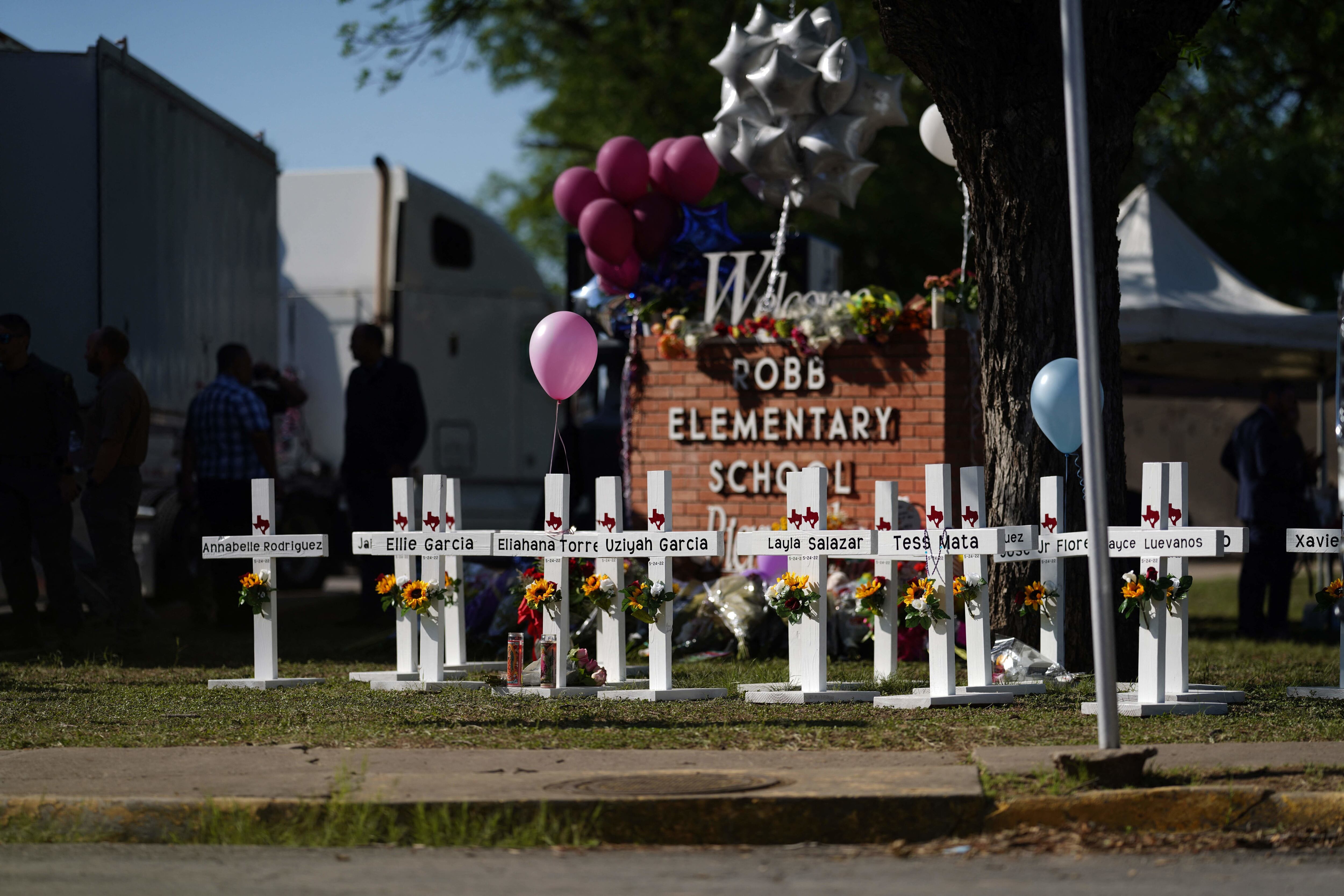 Crosses sit outside the Robb Elementary School in remembrance of those killed on Thursday, in Uvalde, Texas on May 26, 2022. - Grief at the massacre of 19 children at the elementary school in Texas spilled into confrontation on May 25, as angry questions mounted over gun control -- and whether this latest tragedy could have been prevented. The tight-knit Latino community of Uvalde on May 24 became the site of the worst school shooting in a decade, committed by a disturbed 18-year-old armed with a legally bought assault rifle. (Photo by allison dinner / AFP) (Photo by ALLISON DINNER/AFP via Getty Images)
