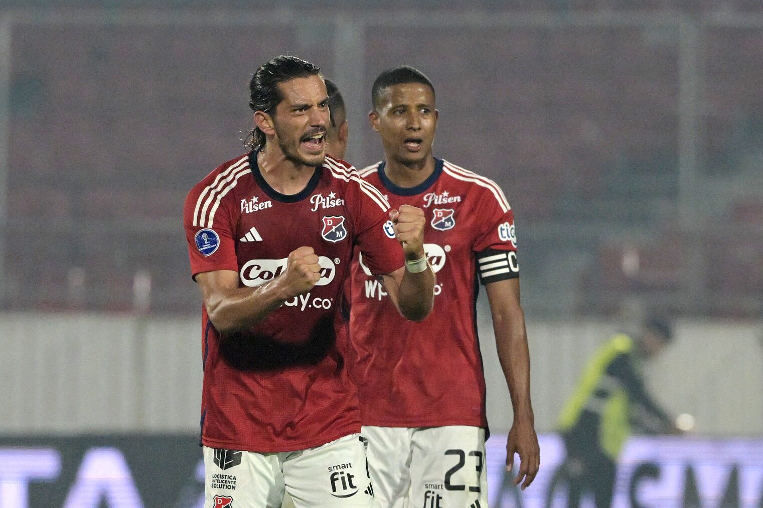 Independiente Medellin's Uruguayan forward Joaquin Varela celebrates his second goal during the Copa Sudamericana round of 16 first leg football match between Chile's Palestino and Colombia's Independiente Medellin at the National stadium in Santiago, on August 14, 2024. (Photo by Rodrigo ARANGUA / AFP) (Photo by RODRIGO ARANGUA/AFP via Getty Images)