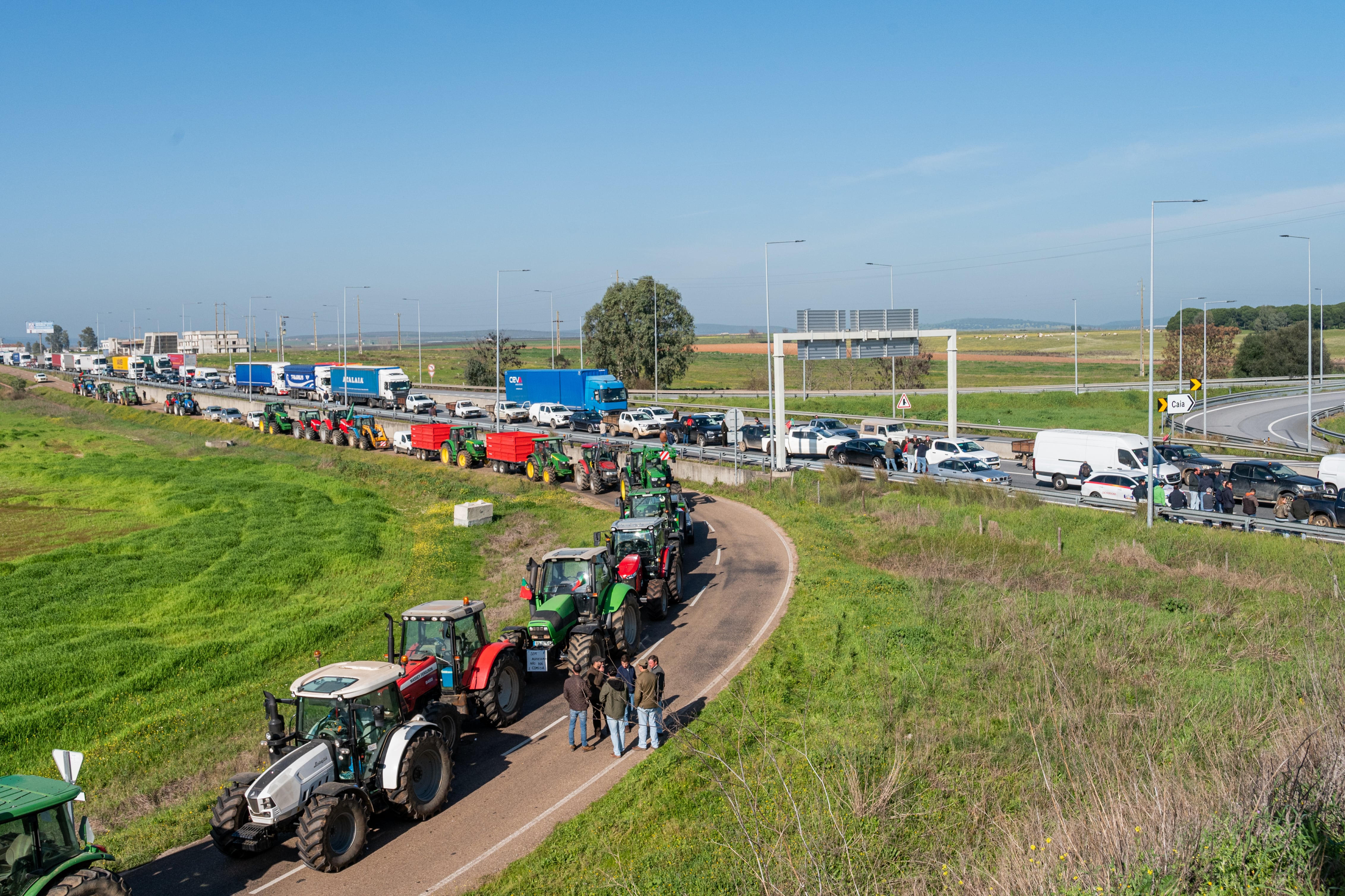 RINCON DE CAYA, BADAJOZ EXTREMA, SPAIN - FEBRUARY 01: Several tractors of Portuguese farmers cut the A6 highway near the border with Spain, on February 1, 2024, in Rincon de Caya, Badajoz, Extremadura, Spain. The protest is part of the mobilizations that are being repeated in other European countries to demand a review of the policies and regulations surrounding the sector. In Brussels, almost 1,500 tractors, bonfires and barricades take place in the center of the city, while the 27 are meeting for an Extraordinary European Council. The Civil Farmers' Movement has been the convener of the protest. In addition, blockades have also been promoted in other areas of Portugal, a day after the Portuguese government announced a 500 million euro aid package. (Photo By Andres Rodriguez/Europa Press via Getty Images)