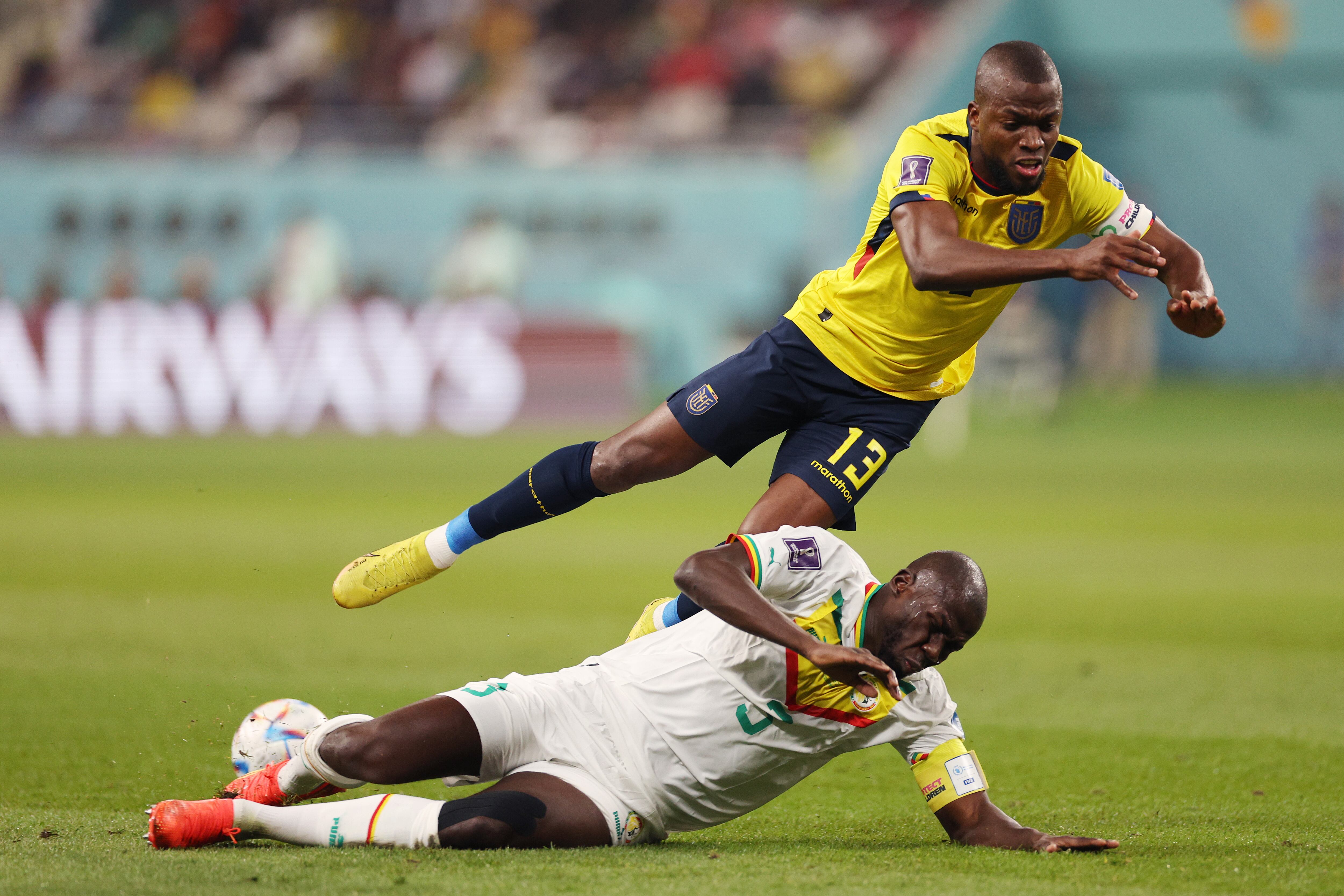 DOHA, QATAR - NOVEMBER 29: Enner Valencia of Ecuador battles for possession with Kalidou Koulibaly of Senegal during the FIFA World Cup Qatar 2022 Group A match between Ecuador and Senegal at Khalifa International Stadium on November 29, 2022 in Doha, Qatar. (Photo by Elsa/Getty Images)
