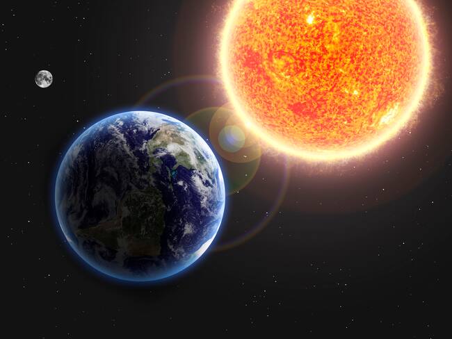Planeta tierra junto al sol y la luna (Foto vía Getty Images)