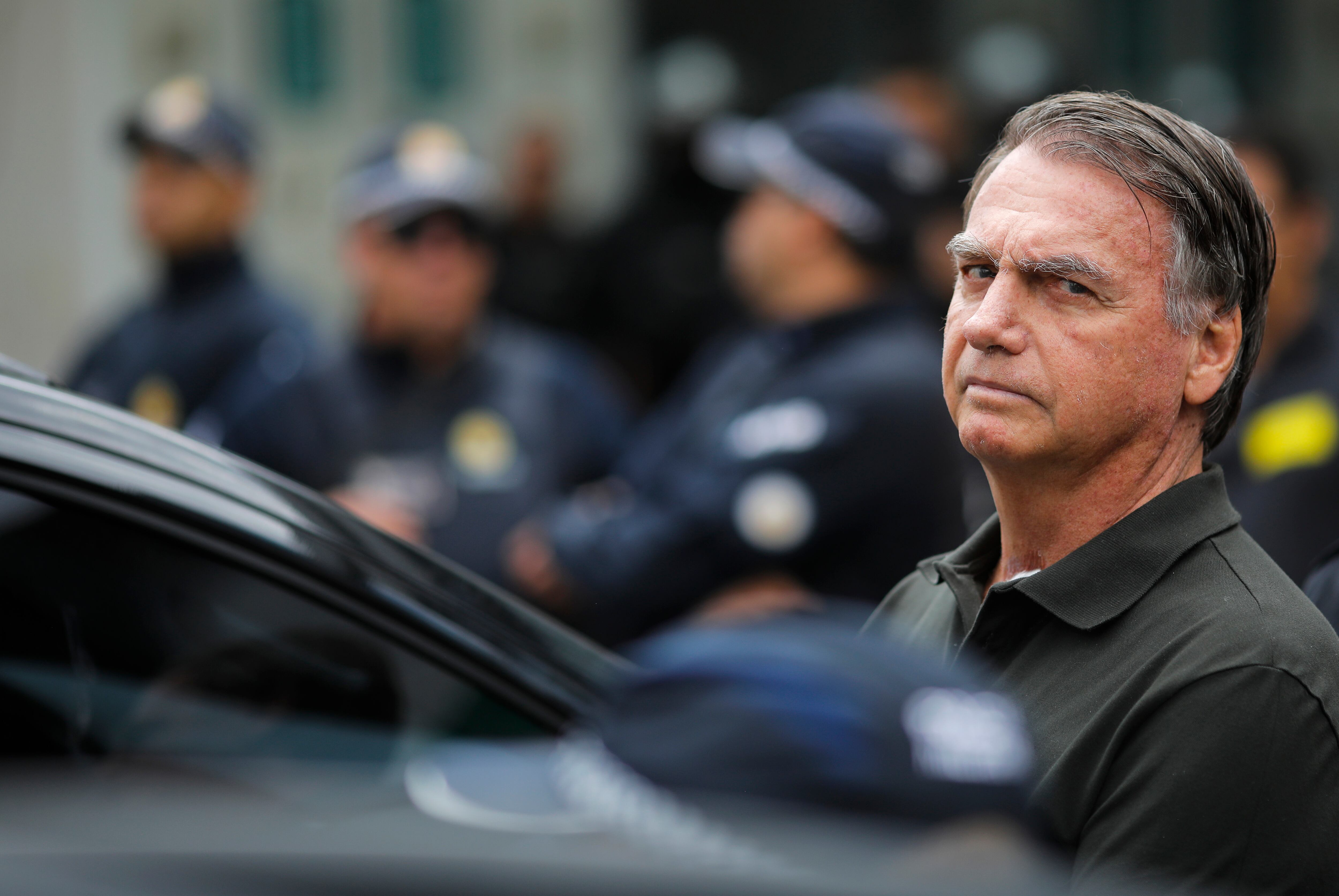 (FILES) Former Brazilian President (2019-2022) Jair Bolsonaro leaves the DF Star hospital in Brasilia on September 14, 2025, after undergoing a series of medical examinations, as he remains under house arrest. Brazil's public prosecutor's office approved on December 23, 2025 a request from lawyers representing former Brazilian President Jair Bolsonaro to release him from prison so he can undergo surgery for an inguinal hernia on December 25, according to a document accessed by AFP. (Photo by Sergio Lima / AFP)