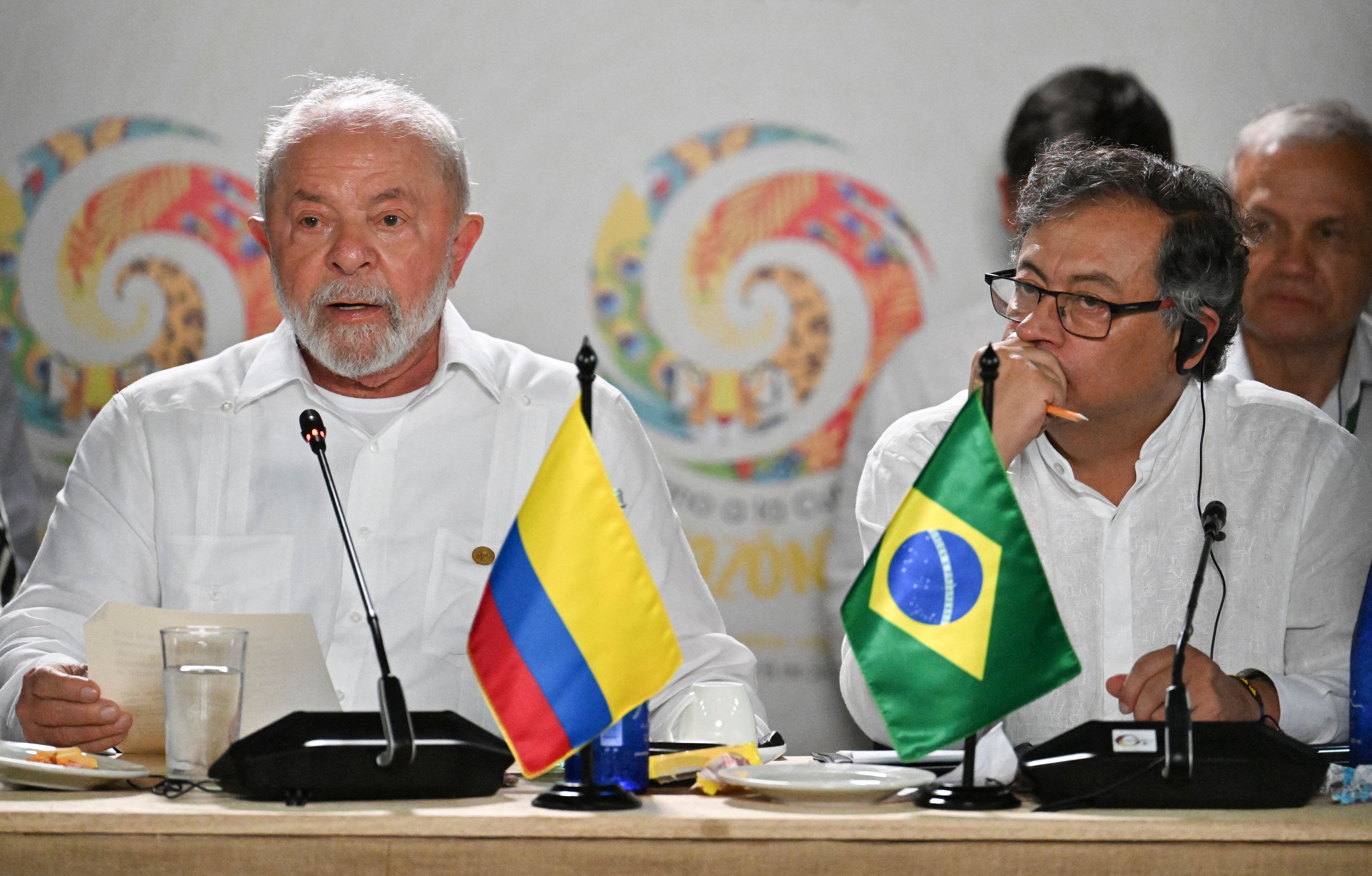 Brazilian President Luiz Inacio Lula da Silva (L) speaks next to Colombian President Gustavo Petro during a meeting for talks on the protection of the Amazon Forest, in Leticia, Colombia, on the border with Brazil, on July 8, 2023. (Photo by Juan BARRETO / AFP) (Photo by JUAN BARRETO/AFP via Getty Images)