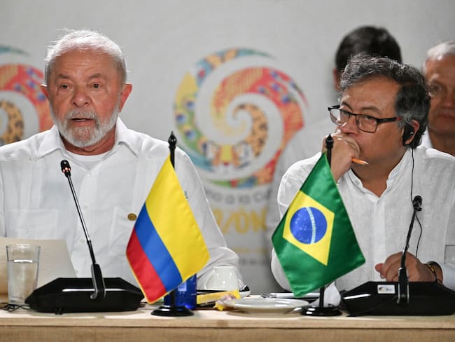 Brazilian President Luiz Inacio Lula da Silva (L) speaks next to Colombian President Gustavo Petro during a meeting for talks on the protection of the Amazon Forest, in Leticia, Colombia, on the border with Brazil, on July 8, 2023. (Photo by Juan BARRETO / AFP) (Photo by JUAN BARRETO/AFP via Getty Images)