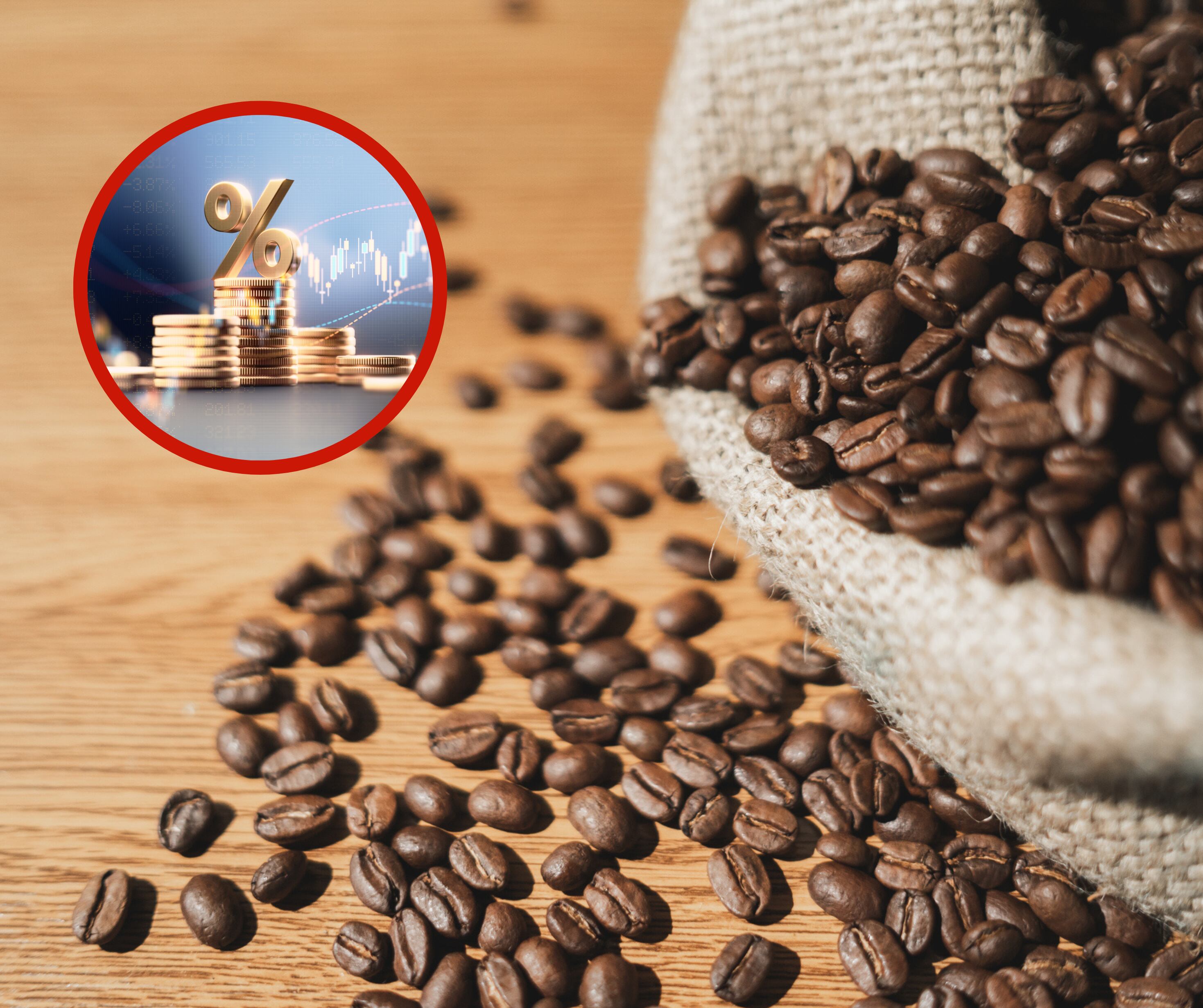 Café junto a unas monedas y símbolos de estadísticas (Fotos vía Getty Images)