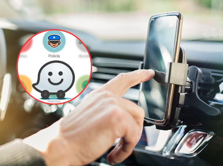 Persona usando su celular dentro del carro / Waze (Getty Images)