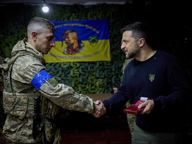 This handout photograph taken and released by the Ukrainian Presidential Press Service on May 16, 2024, shows Ukraine&#039;s President Volodymyr Zelensky (R) awarding a soldier of the 92nd separate assault brigade named after Ivan Sirko, during his visit to Kharkiv.