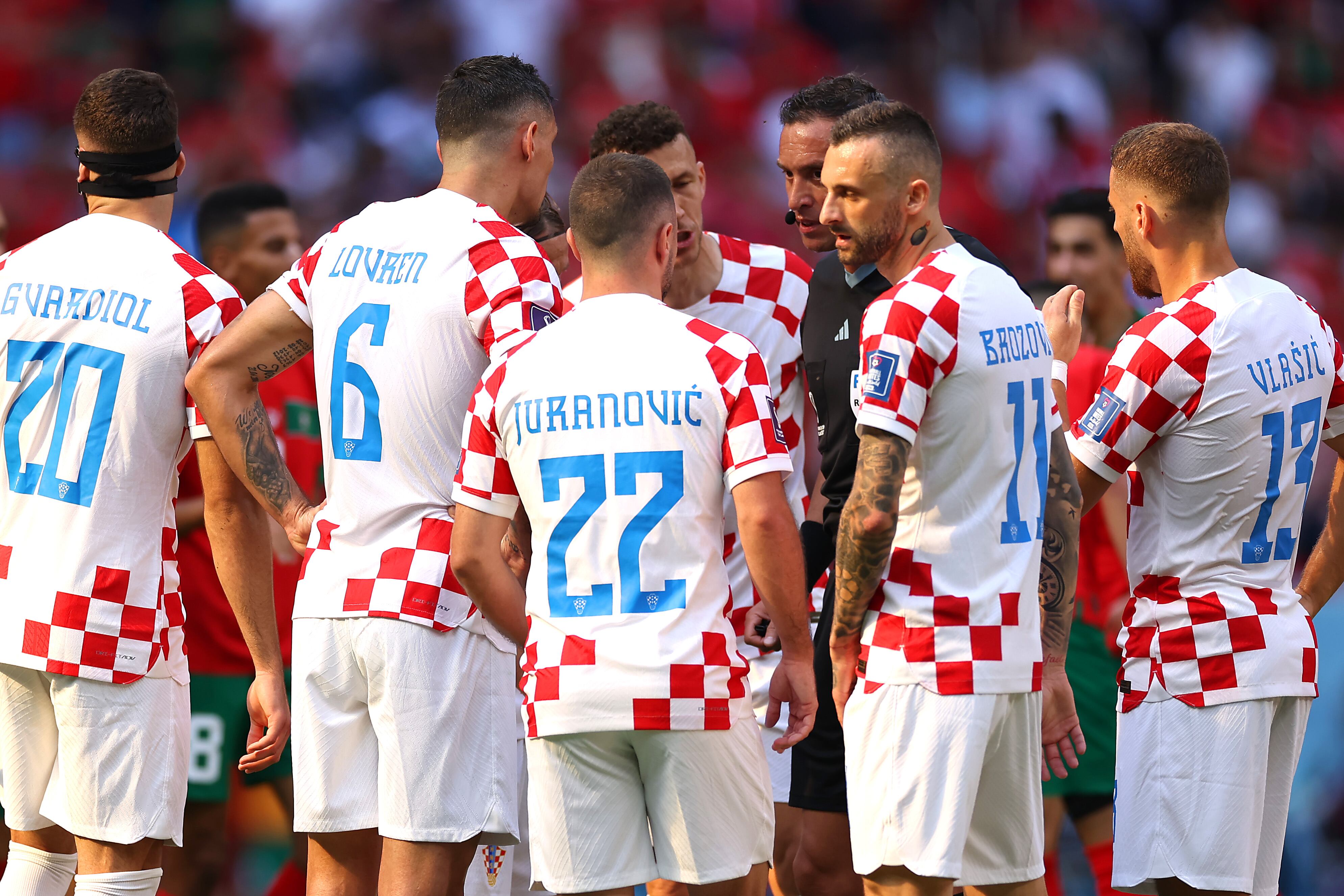 AL KHOR, QATAR - NOVEMBER 23: Croatia players protest to Referee Fernando Andres Rapallini during the FIFA World Cup Qatar 2022 Group F match between Morocco and Croatia at Al Bayt Stadium on November 23, 2022 in Al Khor, Qatar. (Photo by Lars Baron/Getty Images)
