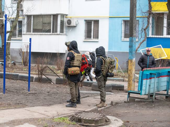DNIPRO, UKRAINE - DECEMBER 29: Search and rescue teams conduct operation after Russian strike hits the city center in Dnipro, Ukraine on December 29, 2023. Appolo mall, the Blue building, maternity hospital and many other buildings were damaged in the attack. Head of the Military Administration of the Dnipro Region, Sergey Lisak stated that there were deaths in the missile attacks carried out by Russia in the morning. (Photo by Arsen Dzodzaiev/Anadolu via Getty Images)