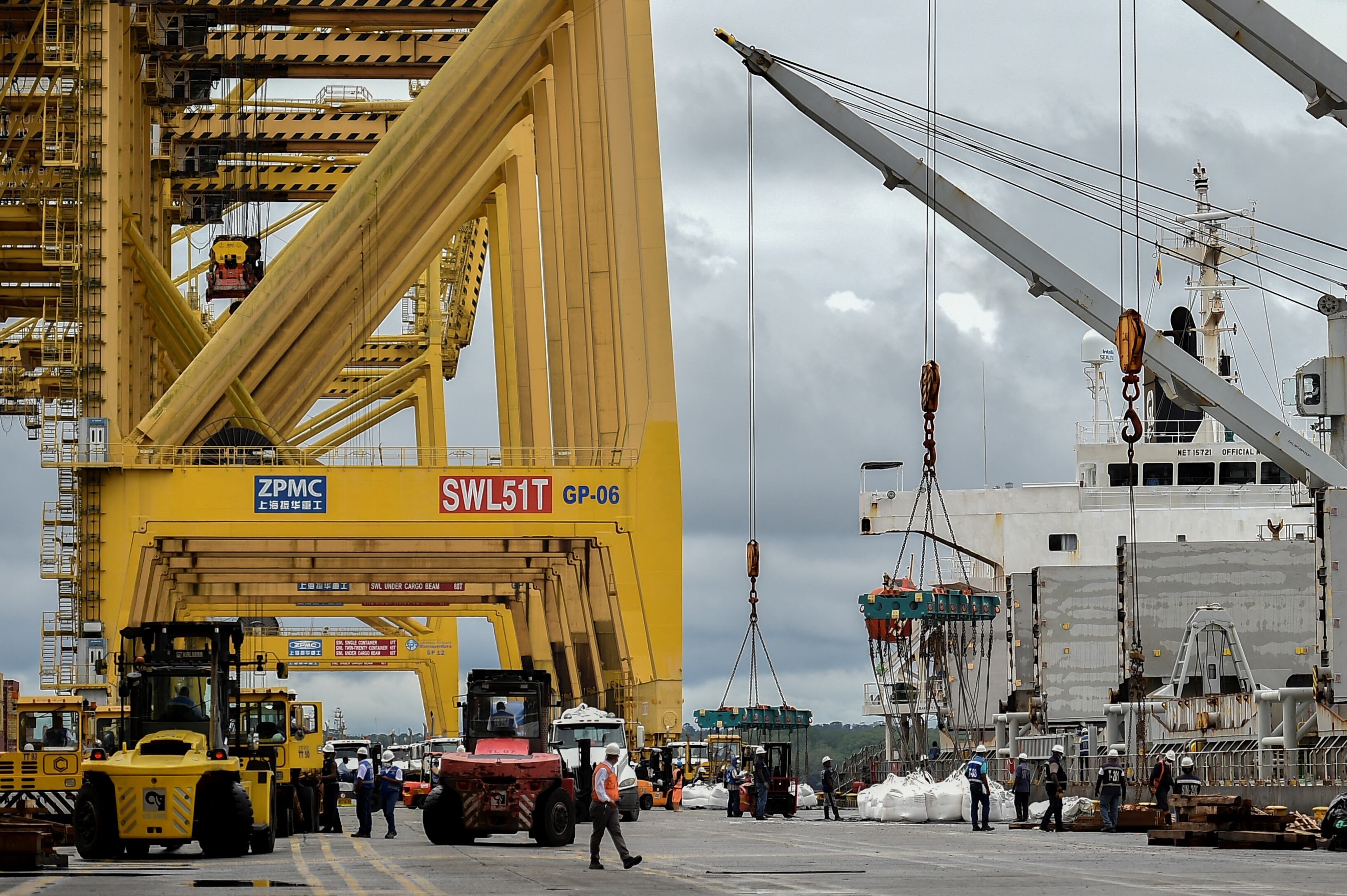 A crane unloads a shipment at the Buenaventura seaport in Buenaventura, Colombia, on January 25, 2022. (Photo by Luis ROBAYO / AFP) (Photo by LUIS ROBAYO/AFP via Getty Images)