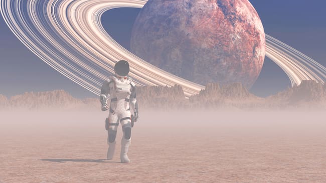 Ilustración de un astronauta y de fondo Saturno. Foto: Getty Images.
