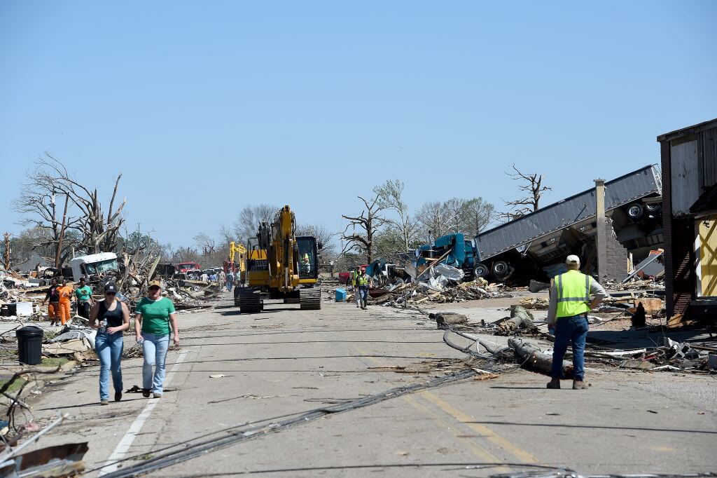 ROLLING FORK, MS - MARCH 25: Workers and community members assess and clear damage from a series of powerful storms and at least one tornado on March 25, 2023 in Rolling Fork, Mississippi. At least 26 people have reportedly been killed with dozens more injured following devastating storms across western Mississippi. (Photo by Will Newton/Getty Images)