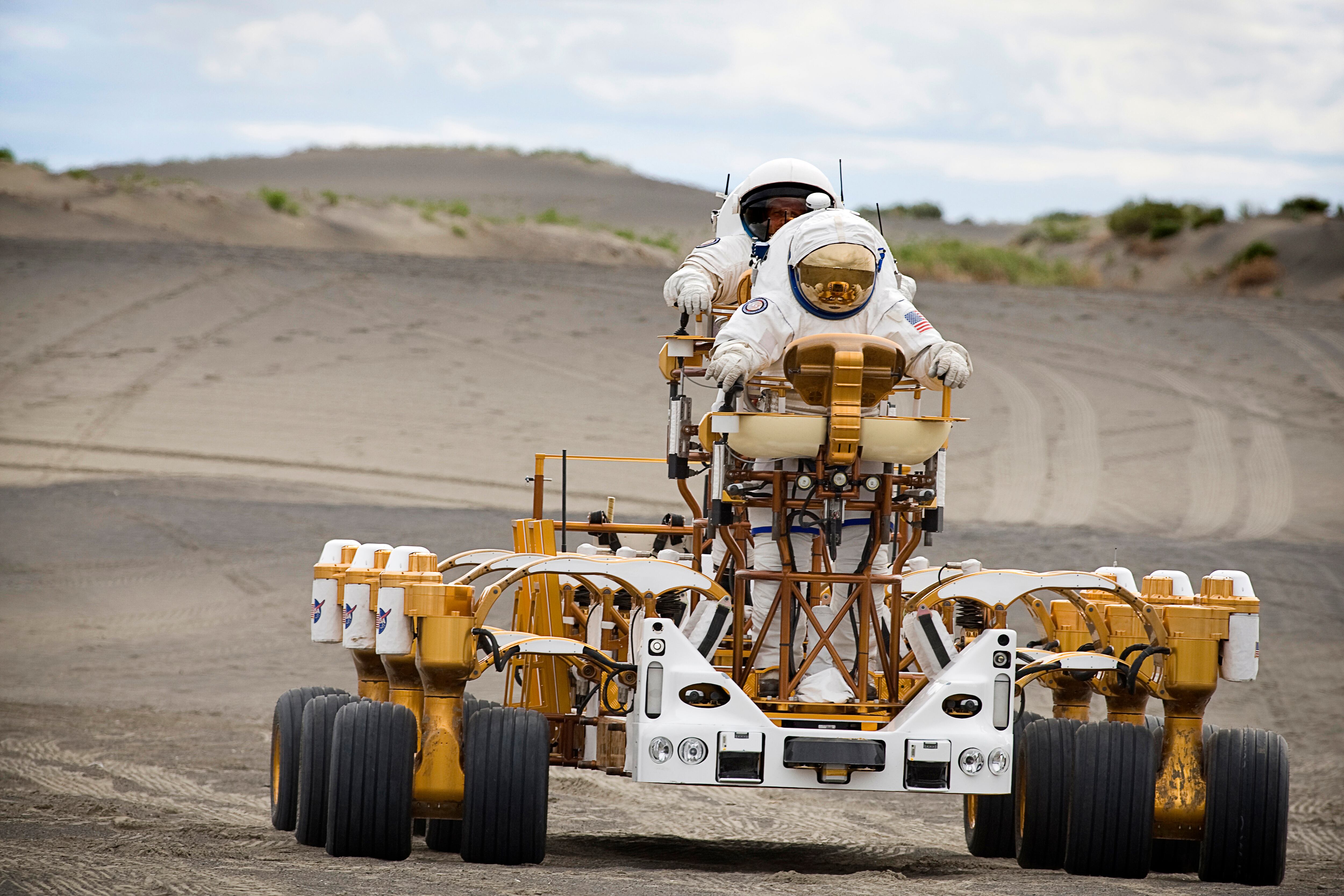 NASA's Human Robotic Systems Project, part of the agency's Exploration Technology Development Program, focused on human and robotic mobility systems for the moon, but also looked at communication and command and control systems that will connect the explorers with Earth and each other. The Moses Lake dunes provided a wide variety of soil consistencies and terrain that allowed the team to put prototype scout robots, rovers, cargo carriers, cranes and spacesuits through tests in a harsh and changing environment. The prototype tests will be used to inform developers of specific requirements needed in lunar surface support systems for the Constellation Program. | Location: Near Moses Lake, Washington, USA.