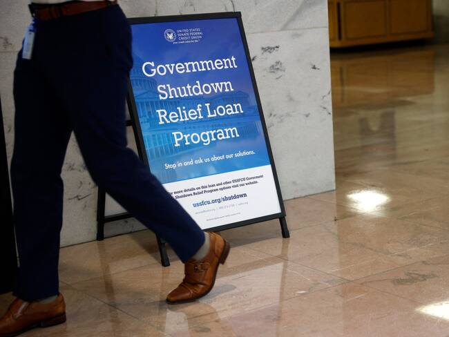 WASHINGTON, DC - SEPTEMBER 30: A sign advertising a government shutdown relief loan is seen outside of the U.S. Senate Federal Credit Union in the Hart Senate Office Building on September 30, 2025 in Washington, DC. If lawmakers fail to reach a bipartisan compromise the federal government shutdown will begin at midnight. Kevin Dietsch/Getty Images/AFP (Photo by Kevin Dietsch / GETTY IMAGES NORTH AMERICA / Getty Images via AFP)