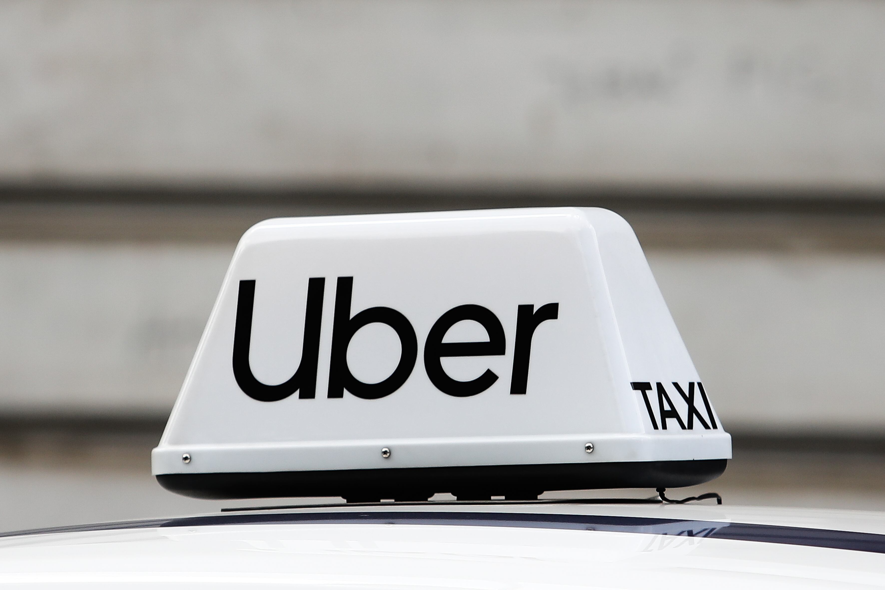 Uber taxi sign is seen on a car in Krakow, Poland, on May 30, 2022. (Photo by Jakub Porzycki/NurPhoto via Getty Images)