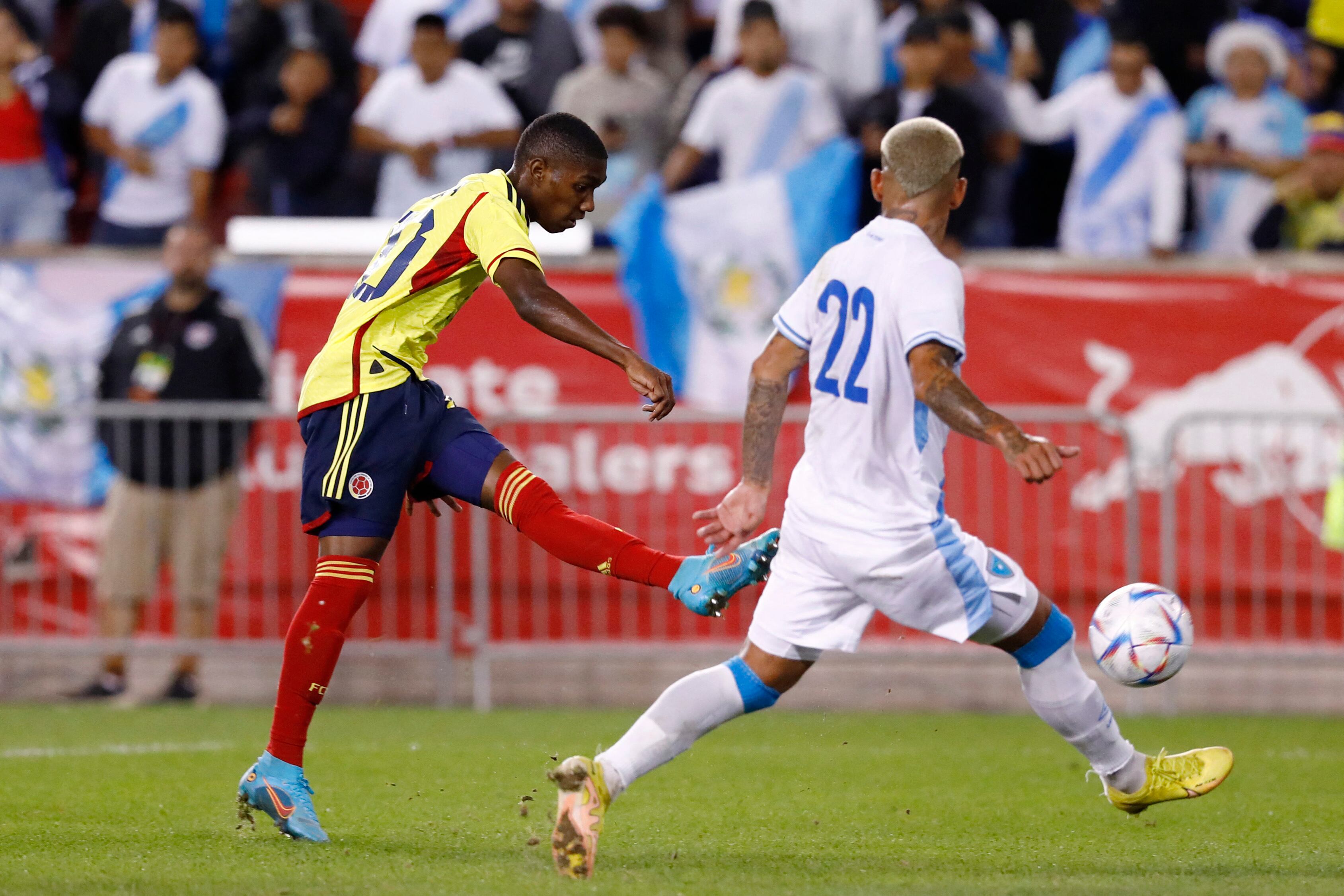 Colombia's Yaser Asprilla (L) shoots to score a goal during the international friendly football match between Colombia and Guatemala at Red Bull Arena in Harrison, New Jersey, on September 24, 2022. (Photo by Andres Kudacki / AFP) (Photo by ANDRES KUDACKI/AFP via Getty Images)