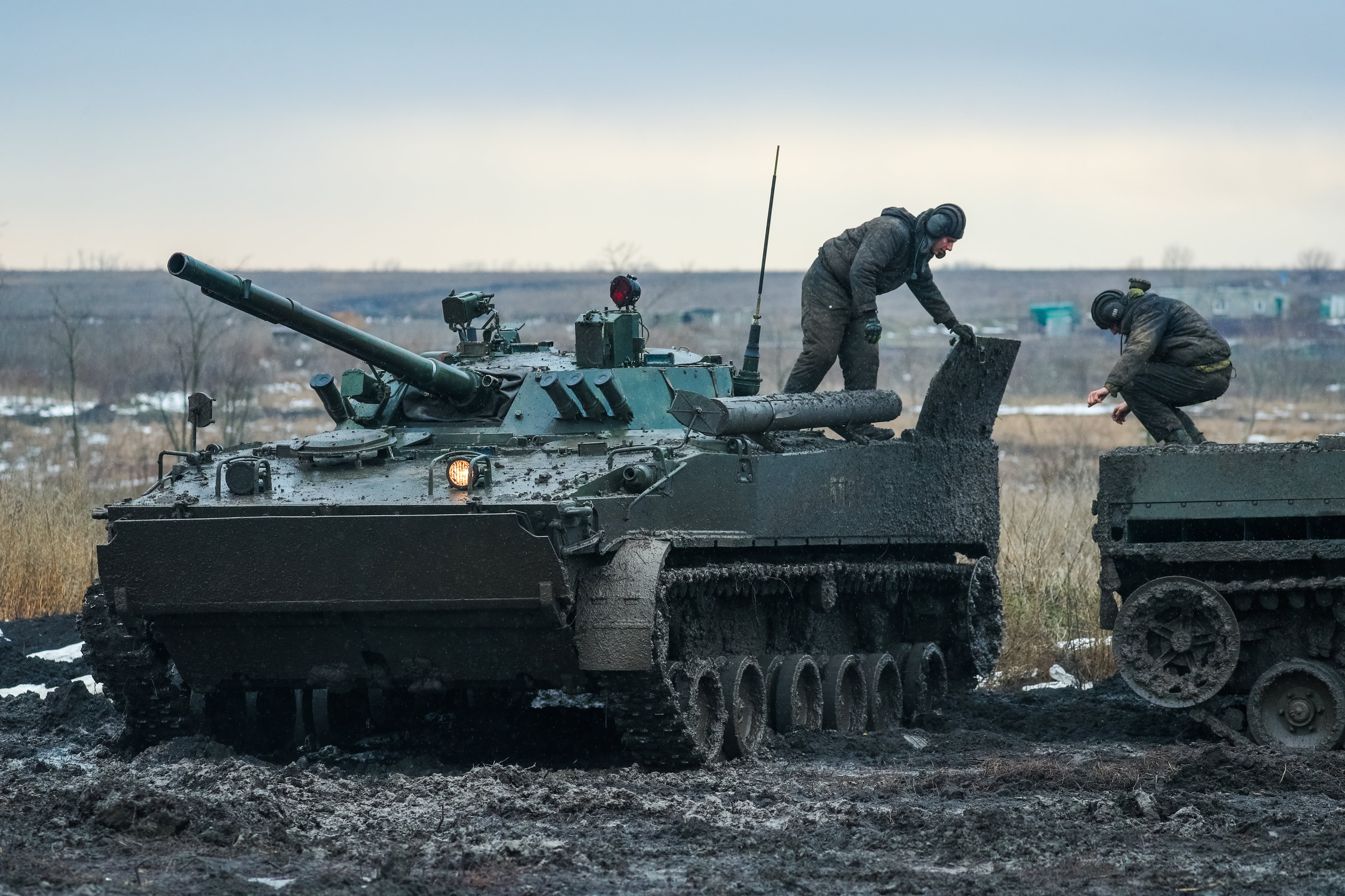 ROSTOV REGION, RUSSIA - FEBRUARY 3, 2022: Servicemen of a motor rifle unit of the Russian Southern Military District are seen on T-72B3 tanks of the tank force of the Russian Western Military District as they take part in a cross country driving exercise at Kadamovsky Range. Erik Romanenko/TASS (Photo by Erik Romanenko\TASS via Getty Images)