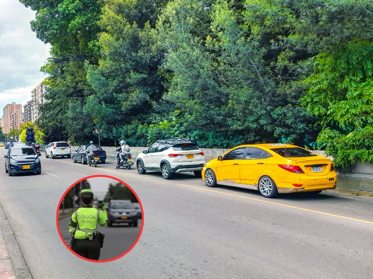 Vía de Colombia con varios vehículos y al lado una Policía de Tránsito (Fotos vía Getty Images y COLPRENSA)