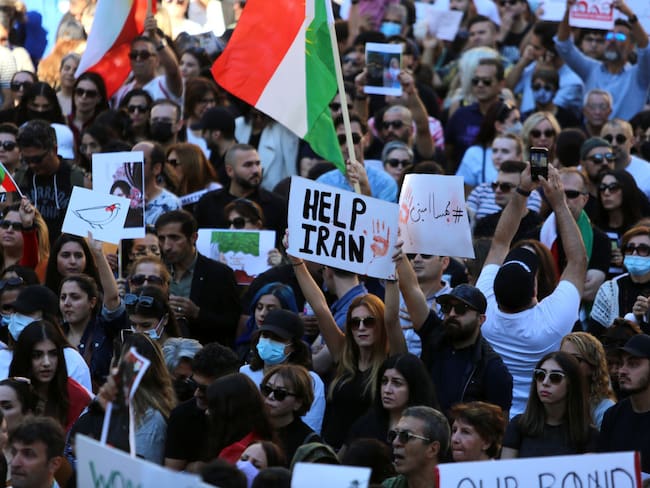 VANCOUVER, BC - SEPTEMBER 25 : Thousands of people gather outside Vancouver Art Gallery, during a solidarity protest for Mahsa Amini, a 22 years old Iranian woman who died under custody by Iran's morality police for not wearing her hijab properly, on September 25, 2022 in Vancouver, British Columbia, Canada. (Photo by Mert Alper Dervis/Anadolu Agency via Getty Images)