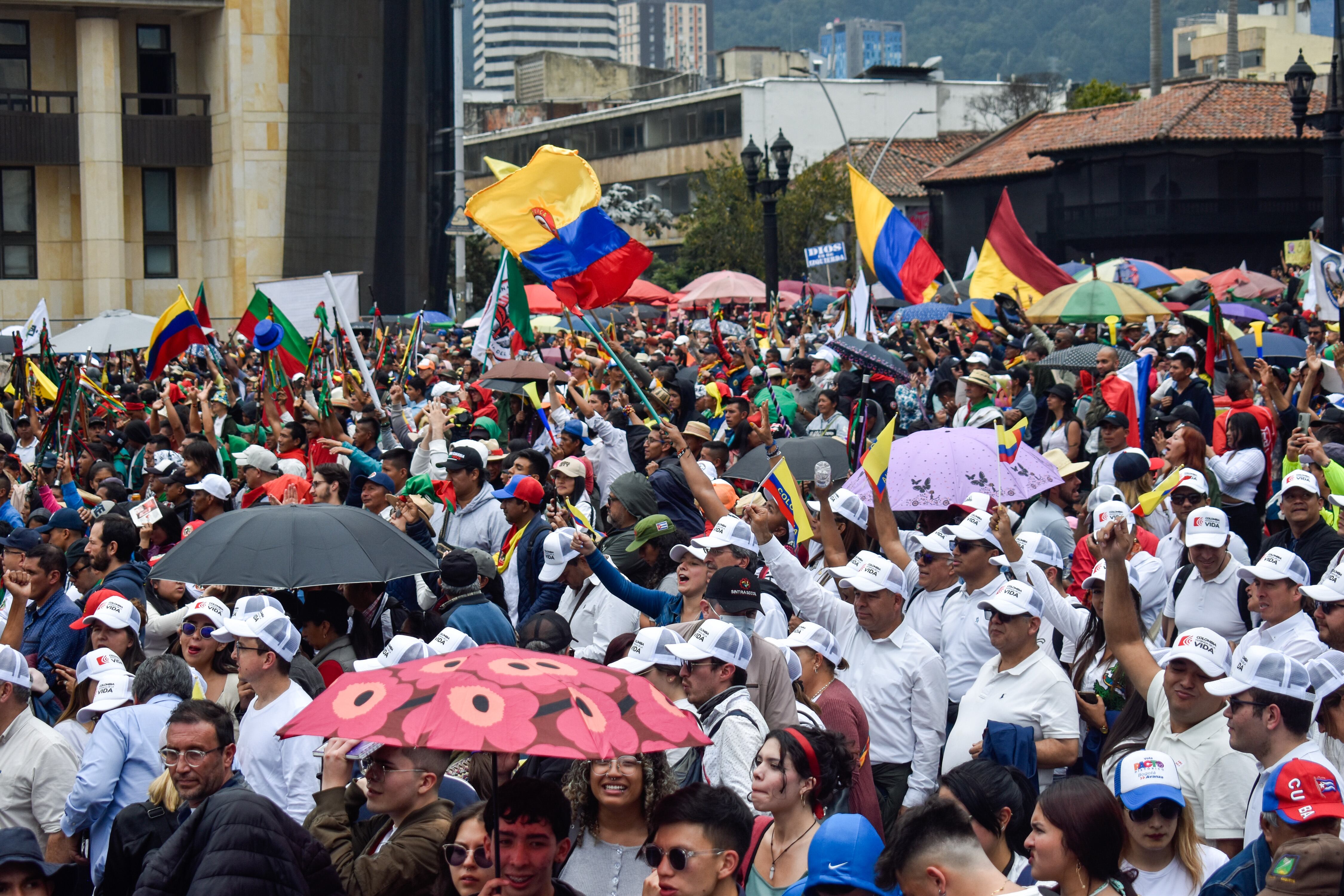 People hold Colombian flags and banners as Colombians march in support for the government proposed social reforms in Bogota, Colombia, September 27, 2023. (Photo by: Cristian Bayona/Long Visual Press/Universal Images Group via Getty Images)
