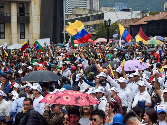 People hold Colombian flags and banners as Colombians march in support for the government proposed social reforms in Bogota, Colombia, September 27, 2023. (Photo by: Cristian Bayona/Long Visual Press/Universal Images Group via Getty Images)