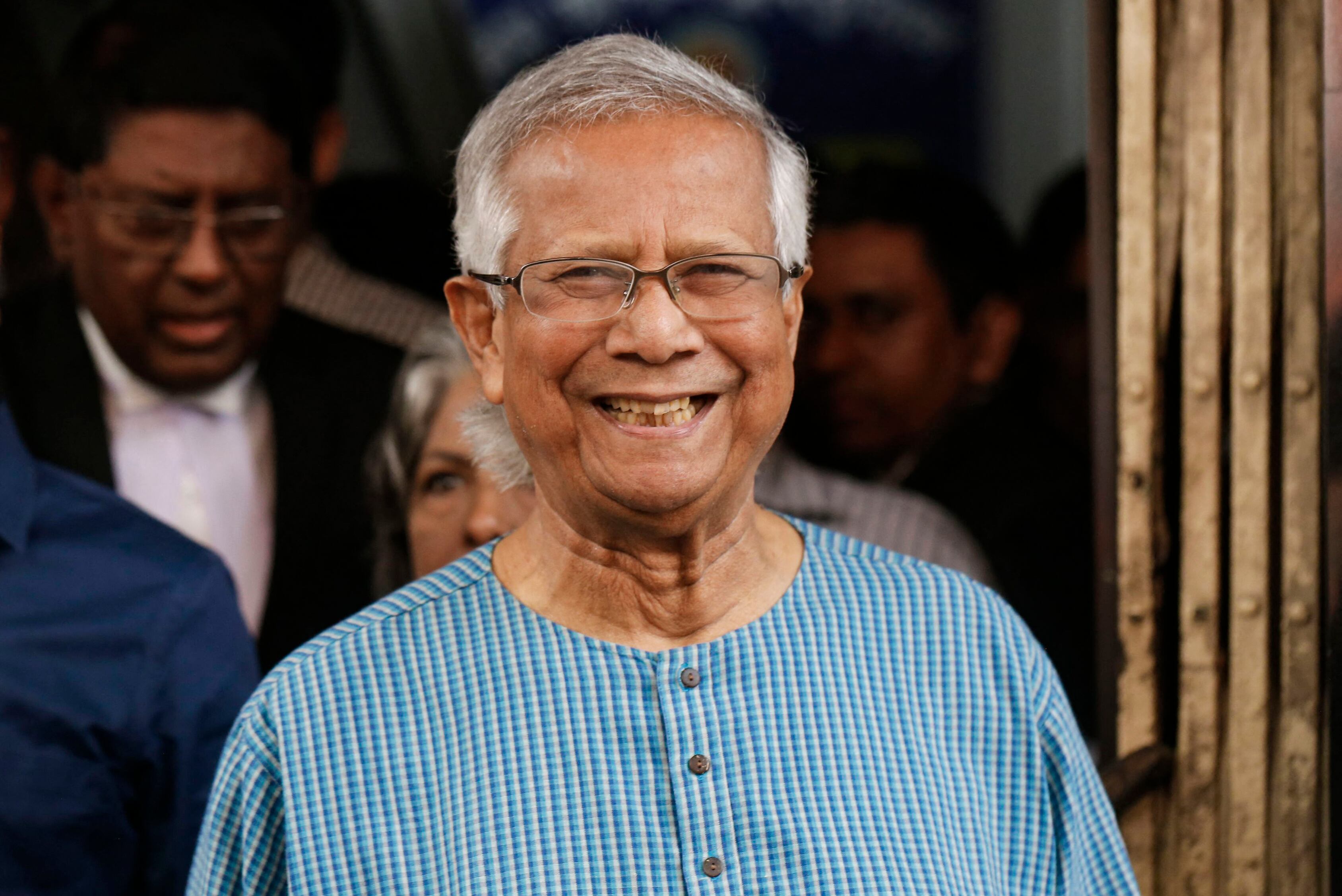 Bangladeshi Nobel peace laureate Muhammad Yunus prepares to leave after filing an appeal for the extension of his bail at Labour Appellate Tribunal in Dhaka on March 3, 2024.