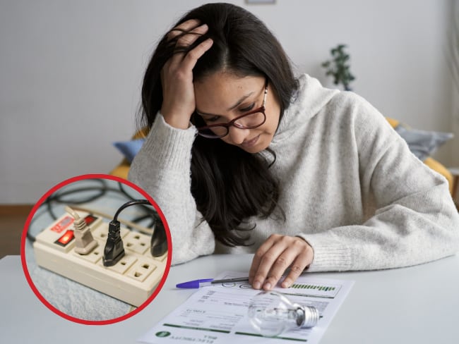 Imagen de referencia mujer mirando el recibo de la luz junto con multitoma/ Getty Images