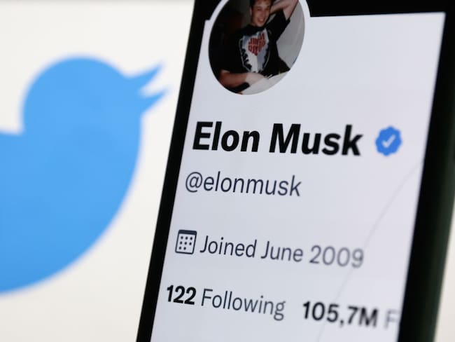 Elon Musk&#039;s Twitter profile displayed on a phone screen and Twitter logo displayed on a screen are seen in this illustration photo taken in Krakow, Poland on September 15, 2022. (Photo by Jakub Porzycki/NurPhoto via Getty Images)