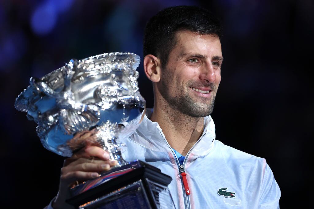 MELBOURNE, AUSTRALIA - JANUARY 29: Novak Djokovic of Serbia poses with the Norman Brookes Challenge Cup after winning the Men's Singles Final match against Stefanos Tsitsipas of Greece during day 14 of the 2023 Australian Open at Melbourne Park on January 29, 2023 in Melbourne, Australia. (Photo by Cameron Spencer/Getty Images)